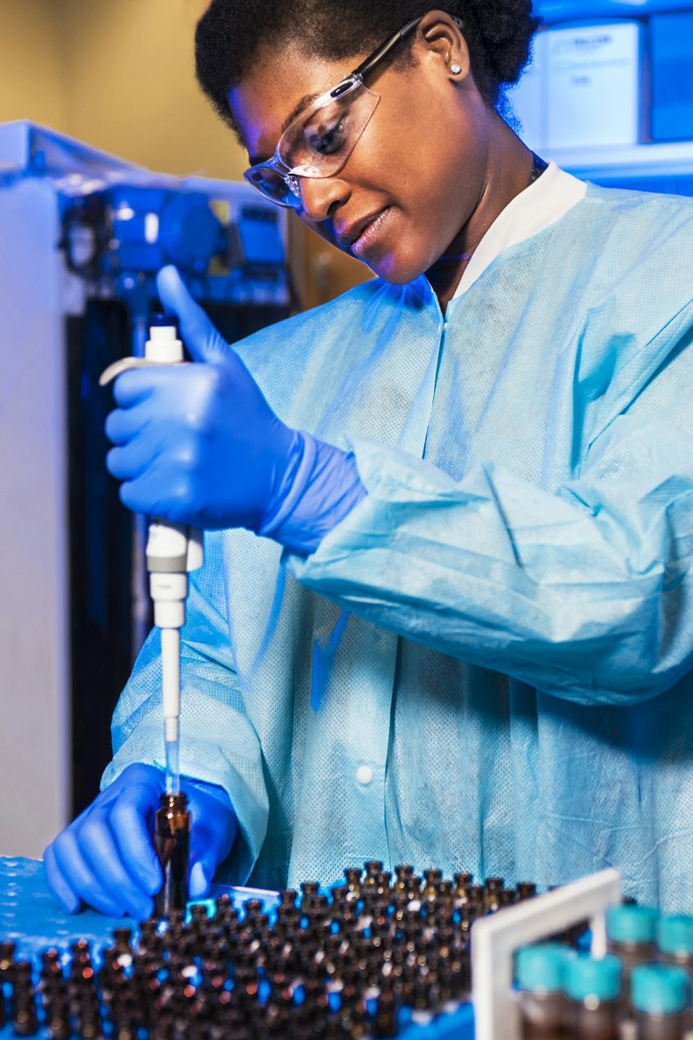 Scientist using a pipette in a laboratory